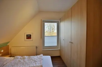 Ein Bett oder Betten in einem Zimmer der Unterkunft Wattwagen, RW4