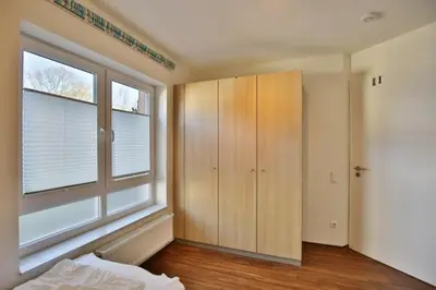 Ein Bett oder Betten in einem Zimmer der Unterkunft Wattwagen, RW3