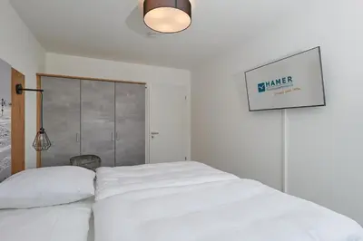 Ein Bett oder Betten in einem Zimmer der Unterkunft Nordstrand, N303
