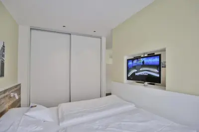Ein Bett oder Betten in einem Zimmer der Unterkunft Duhner Strandhus, S1