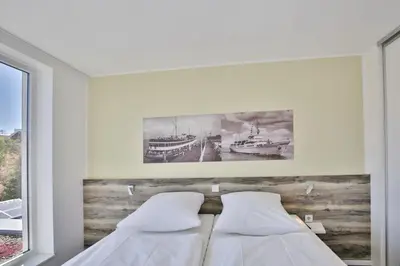 Ein Bett oder Betten in einem Zimmer der Unterkunft Duhner Strandhus, S212