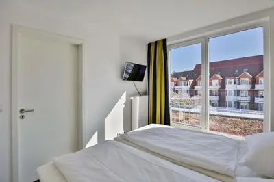 Ein Bett oder Betten in einem Zimmer der Unterkunft Duhner Strandhus, S212