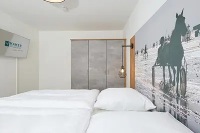 Ein Bett oder Betten in einem Zimmer der Unterkunft Nordstrand, N204