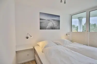 Ein Bett oder Betten in einem Zimmer der Unterkunft Hohe Worth, H201