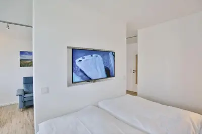 Ein Bett oder Betten in einem Zimmer der Unterkunft Hohe Worth, H201