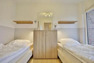 Ein Bett oder Betten in einem Zimmer der Unterkunft Hohe Worth, H309