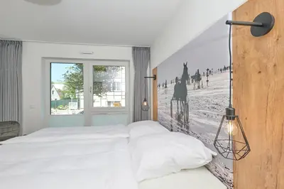 Ein Bett oder Betten in einem Zimmer der Unterkunft Nordstrand, N103