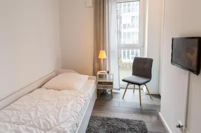 Ein Bett oder Betten in einem Zimmer der Unterkunft Haus Yachthafen, KY5