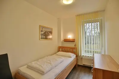 Ein Bett oder Betten in einem Zimmer der Unterkunft Rugenbarg, RR4