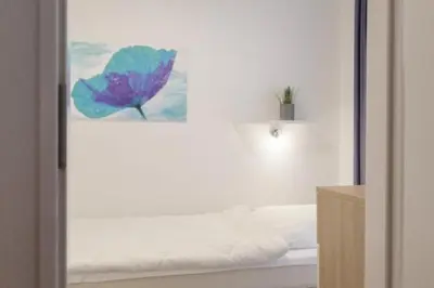 Ein Bett oder Betten in einem Zimmer der Unterkunft Hohe Worth, H305