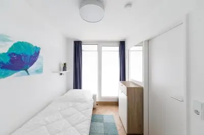 Ein Bett oder Betten in einem Zimmer der Unterkunft Hohe Worth, H305