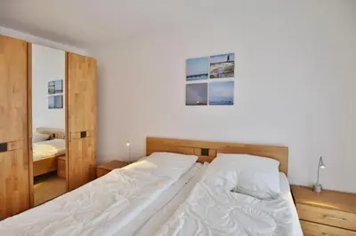 Ein Bett oder Betten in einem Zimmer der Unterkunft Duhner Brise, DB7