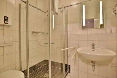 Ein Badezimmer in der Unterkunft Duhner Brise, DB7