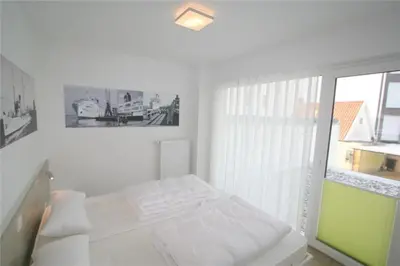 Ein Bett oder Betten in einem Zimmer der Unterkunft Duhner Brandung, B9