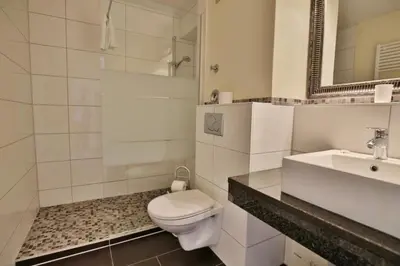 Ein Badezimmer in der Unterkunft Hohe Worth, H212