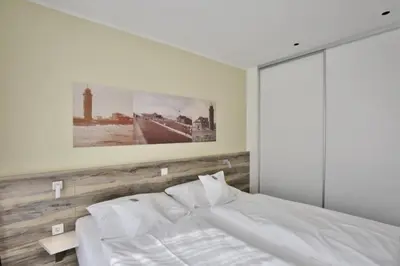 Ein Bett oder Betten in einem Zimmer der Unterkunft Duhner Strandhus, S3