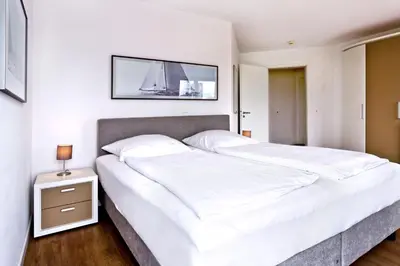 Ein Bett oder Betten in einem Zimmer der Unterkunft Residenz am Yachthafen, RY7