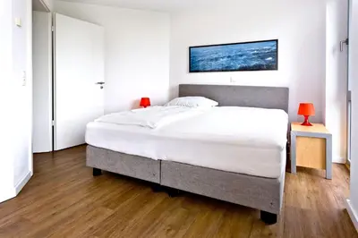 Ein Bett oder Betten in einem Zimmer der Unterkunft Residenz am Yachthafen, RY7