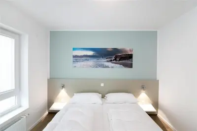Ein Bett oder Betten in einem Zimmer der Unterkunft Duhner Brandung, B4