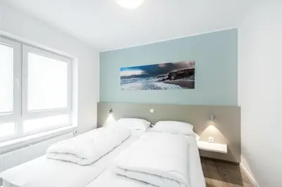 Ein Bett oder Betten in einem Zimmer der Unterkunft Duhner Brandung, B4