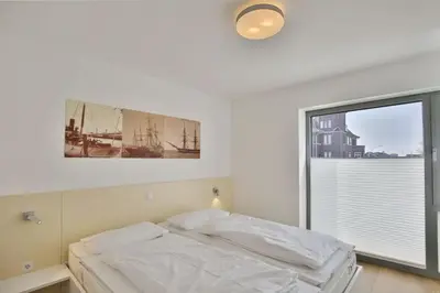 Ein Bett oder Betten in einem Zimmer der Unterkunft Alte Liebe, RA105