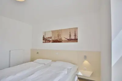 Ein Bett oder Betten in einem Zimmer der Unterkunft Alte Liebe, RA105