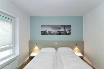 Ein Bett oder Betten in einem Zimmer der Unterkunft Duhner Brandung, B1