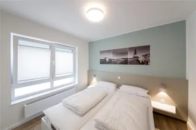 Ein Bett oder Betten in einem Zimmer der Unterkunft Duhner Brandung, B1