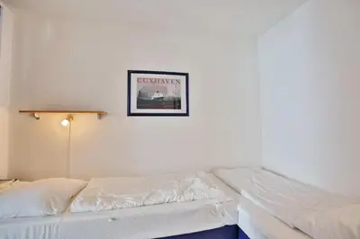 Ein Bett oder Betten in einem Zimmer der Unterkunft Hohe Worth, H8