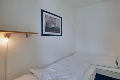 Ein Bett oder Betten in einem Zimmer der Unterkunft Hohe Worth, H8
