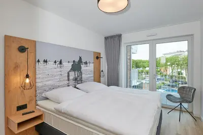 Ein Bett oder Betten in einem Zimmer der Unterkunft Nordstrand, N302