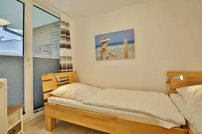 Ein Bett oder Betten in einem Zimmer der Unterkunft Hohe Worth, H10