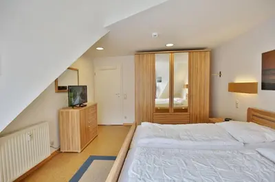 Ein Bett oder Betten in einem Zimmer der Unterkunft Seemöwe, SM9