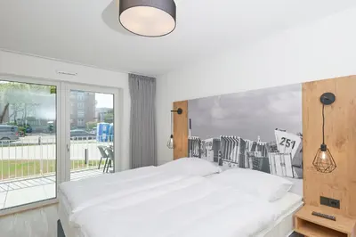 Ein Bett oder Betten in einem Zimmer der Unterkunft Nordstrand, N102