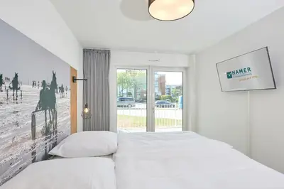 Ein Bett oder Betten in einem Zimmer der Unterkunft Nordstrand, N102