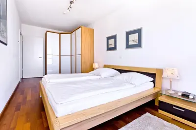 Ein Bett oder Betten in einem Zimmer der Unterkunft Residenz am Yachthafen, RY26