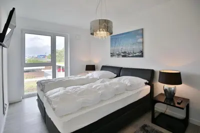 Ein Bett oder Betten in einem Zimmer der Unterkunft Kapitän Alexander, KA47