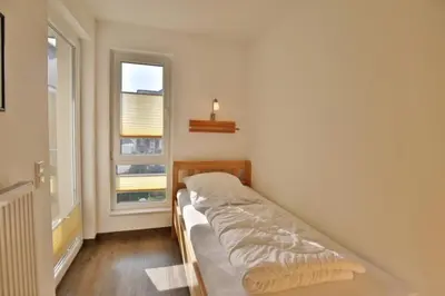 Ein Bett oder Betten in einem Zimmer der Unterkunft Am Seedeich 14, AS5
