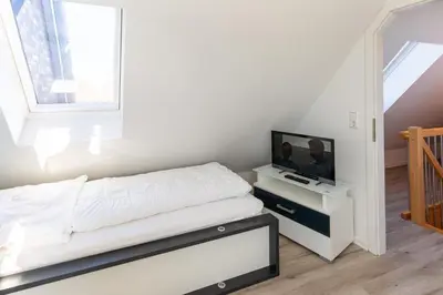 Ein Bett oder Betten in einem Zimmer der Unterkunft Ruge Bries, RB18