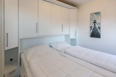 Ein Bett oder Betten in einem Zimmer der Unterkunft Ruge Bries, RB18