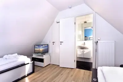 Ein Bett oder Betten in einem Zimmer der Unterkunft Ruge Bries, RB18