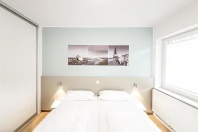 Ein Bett oder Betten in einem Zimmer der Unterkunft Duhner Brandung, B5
