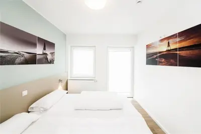 Ein Bett oder Betten in einem Zimmer der Unterkunft Duhner Brandung, B5