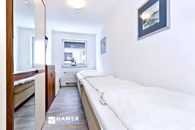 Ein Bett oder Betten in einem Zimmer der Unterkunft Duhner Brise, DB16