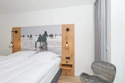 Ein Bett oder Betten in einem Zimmer der Unterkunft Nordstrand, N202