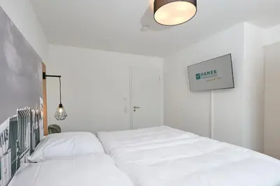 Ein Bett oder Betten in einem Zimmer der Unterkunft Nordstrand, N202