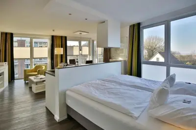Ein Bett oder Betten in einem Zimmer der Unterkunft Duhner Strandhus, S202