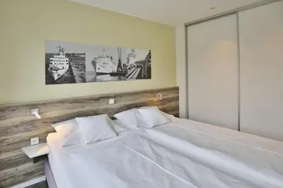 Ein Bett oder Betten in einem Zimmer der Unterkunft Duhner Strandhus, S101