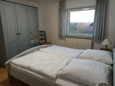Ein Bett oder Betten in einem Zimmer der Unterkunft Stranddüne, D24