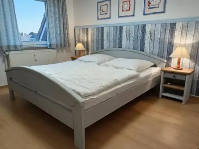 Ein Bett oder Betten in einem Zimmer der Unterkunft Stranddüne, D24